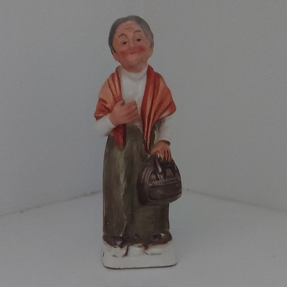 Charming Figurine with Orange Shawl